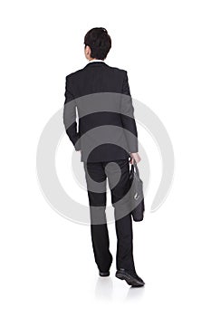 Back view of a business man walking