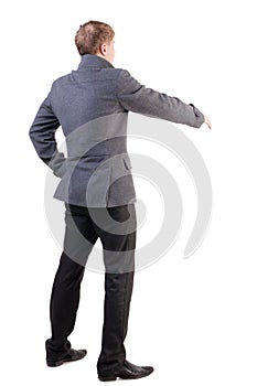 Back view of businessman in coat