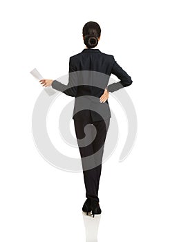 Back view of a businesswoman with paper notes