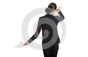 Back view of a businesswoman with paper notes