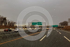 At the back is the view of the city and the rain falling on the glass