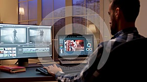 Back view of content creator working in home office