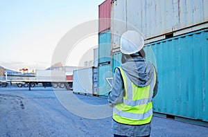 Back view, delivery and woman in logistics working on container inspection at export delivery supply chain warehouse