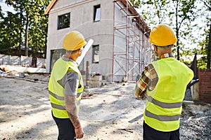 back view of devoted cottage builders