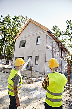 back view of devoted cottage builders