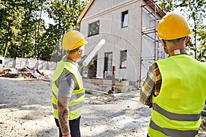 back view of devoted cottage builders