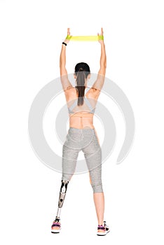 Back view of disabled sportswoman with