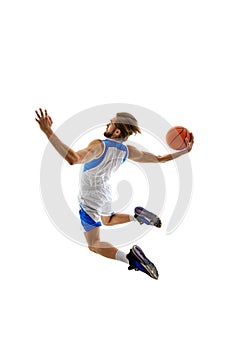 Back view dynamic image of young man, basketball player in motion with ball, scoring goal. practicing isolated on white