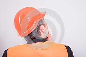 Back view of engineer making thinking gesture