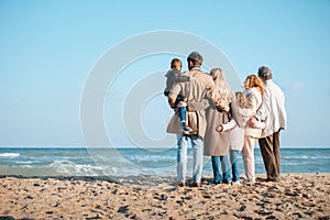 back view of family embracing and spending time