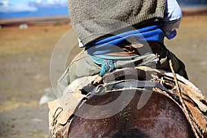 Back view of gaucho riding horse in Argentina photo