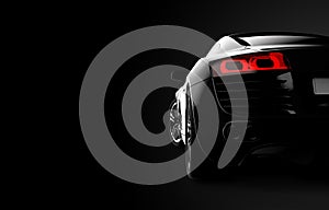 Back view of a generic and brandless modern car on a black background