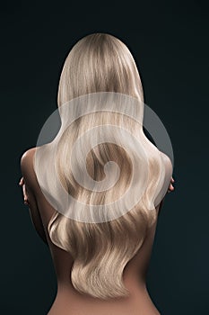 back view of girl with beautiful long blonde hair