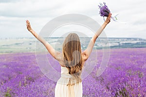 Back view of girl at purple lavender field