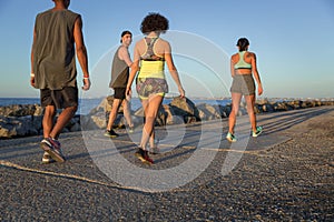 Back view of a group of young people doing sports