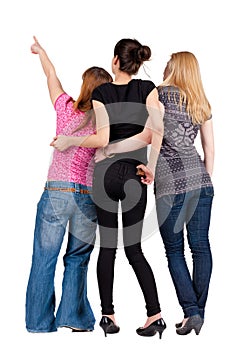Back view of group young women pointing .