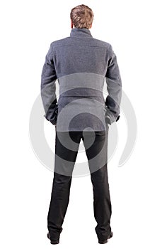 Back view of handsome business man in coat