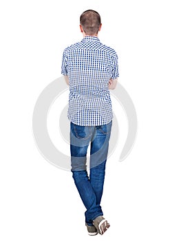 Back view of handsome man in shirt looking up.