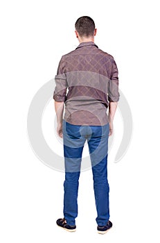 Back view of handsome man in shirt looking up.