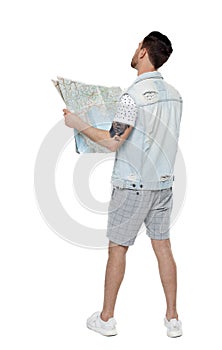 Back view of  journey  young man looking at the map