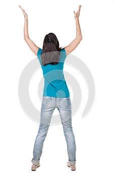 Back view of joyful woman celebrating victory hands up