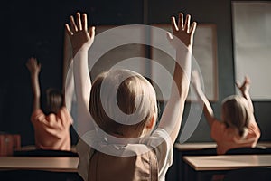 Back view of little boy raising hands up while sitting in classroom at school, Little students full rear view raising their hands