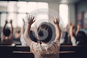 Back view of little boy raising his hands while sitting in the auditorium, Little students full rear view raising their hands, Ai