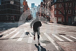 Sportsman training on urban streets photo