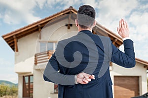 Back view of male realtor with finger crossed