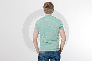 Back view male tshirt mockup. Young man wearing blank mint t-shirt isolated on white background. Copy space. Place for