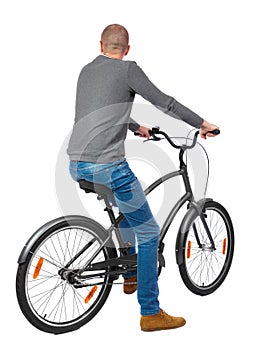 Back view of a man with a bicycle.