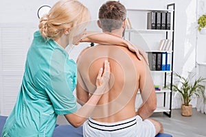 back view of man having chiropractic adjustment