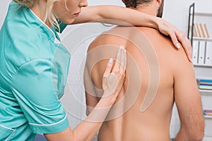 back view of man having chiropractic adjustment