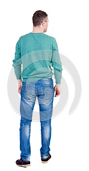 Back view of man in jeans.