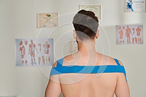 back view of man with kinesiological