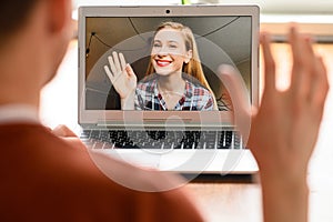 A guy is using laptop for video call, zoom photo