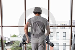 back view man treadmill. High quality photo