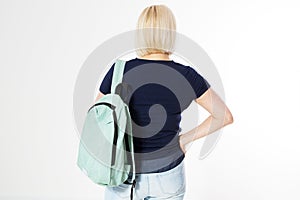 Back view of a middle-age woman with a backpack isolated over white background