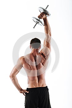 Back view photo of strong crossfit man lifting up heavy dumbbell