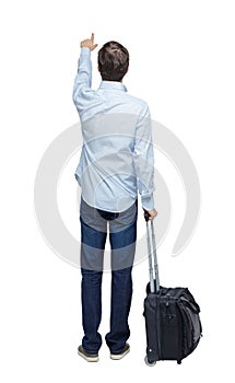 Back view of pointing business man with suitcase