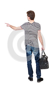 Back view of pointing man with bag.