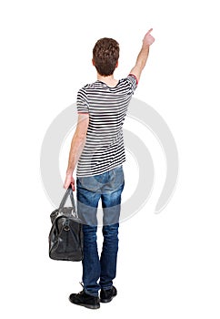 Back view of pointing man with bag.
