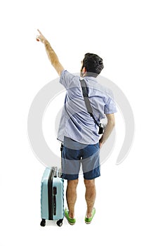 Back view of pointing man with suitcase. Backside view of person. Guy with a travel bag on wheels looking at something at the top