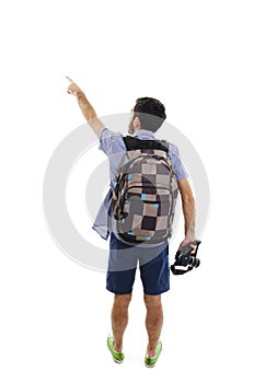 Back view of pointing man with suitcase. Backside view of person. Guy with a travel bag on wheels looking at something at the top