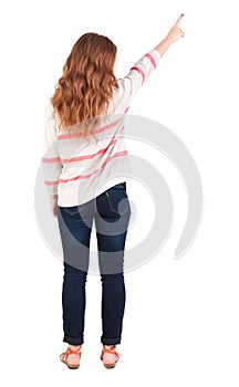 Back view of pointing woman.