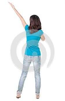 Back view of pointing woman.