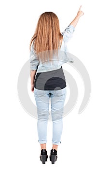 Back view of pointing woman.