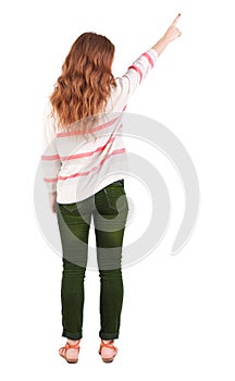 Back view of pointing woman.