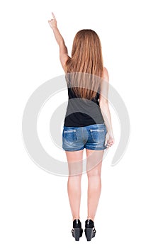 Back view of pointing woman