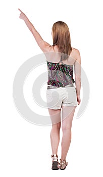 Back view of pointing woman.